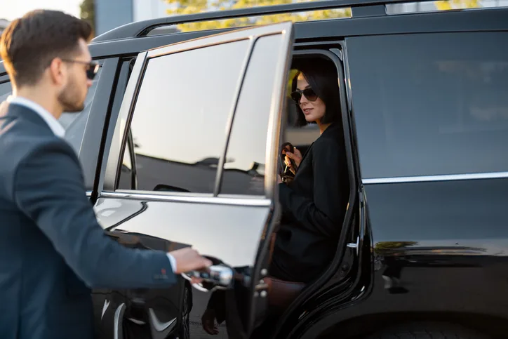 Chauffeur greeting executive at Chicago corporate pickup